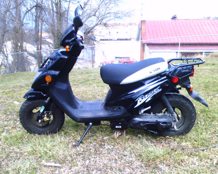 Motorbike in the Back Yard
Thomas's motorbike, just after being filled with gasoline for a ride around town.
